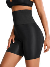 Black athletic shorts worn by a person on a light gray background